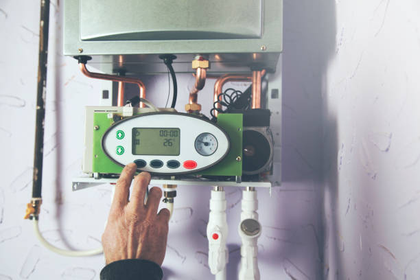 istock worker set up central gas heating boiler at home 1066245764