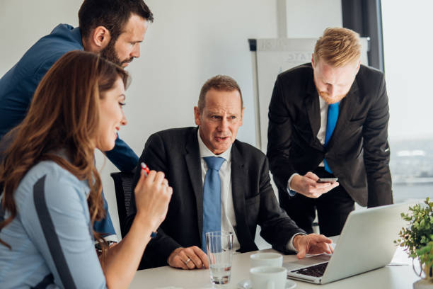 istock Coworkers gathered at office 1066248604