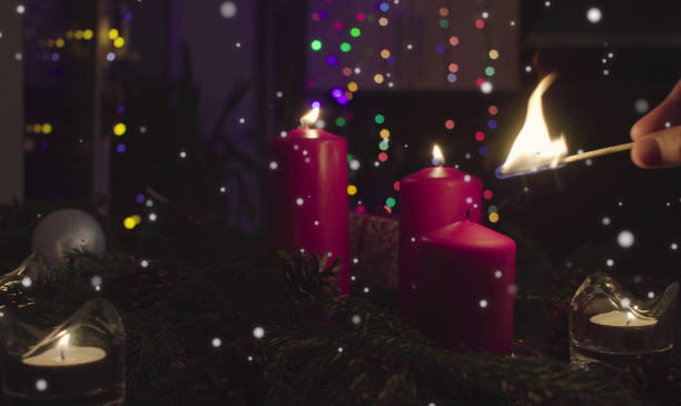 istock Female hands lighting candles in dark room 1066249276