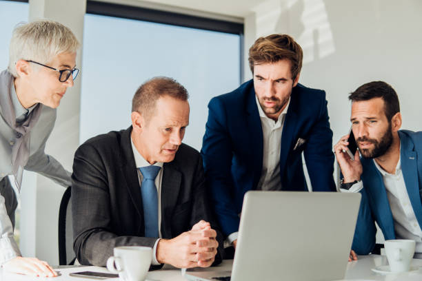 istock Young businessman with coworkers 1066249286