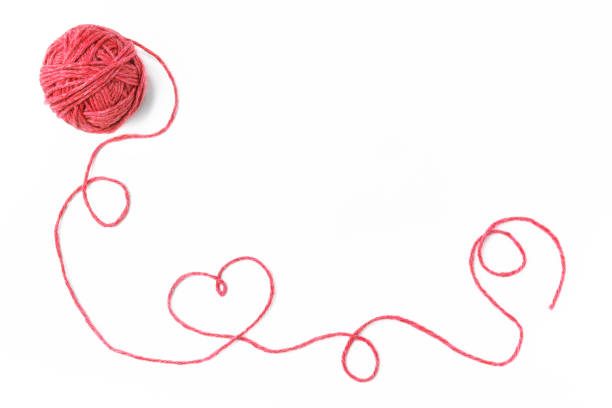 istock Red thread, heart and tangle on white background 1066251558