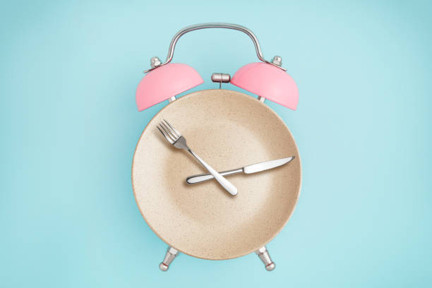 Alarm clock and plate with cutlery