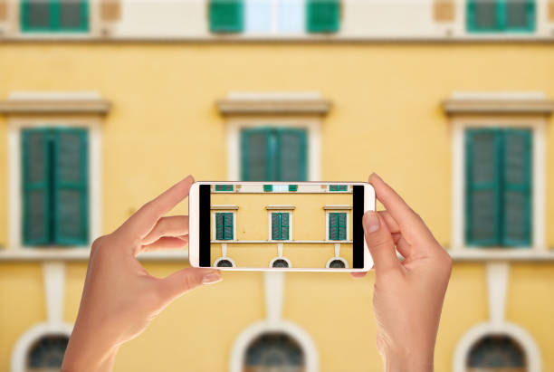 istock Tourist makes a photo of pattern with windows 1066251844