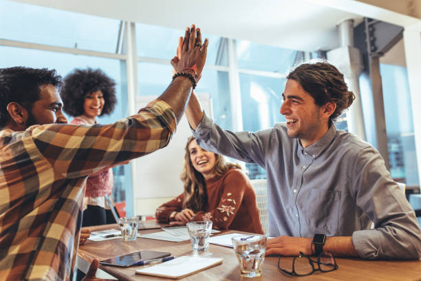 istock Business colleagues giving high five 1066254298
