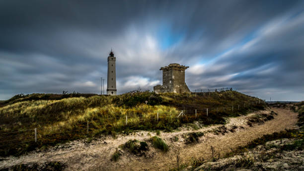 Light house and bunker at a beach in Denmark This picture was taken in November 2018 in Billund Denmark. billund stock pictures, royalty-free photos & images