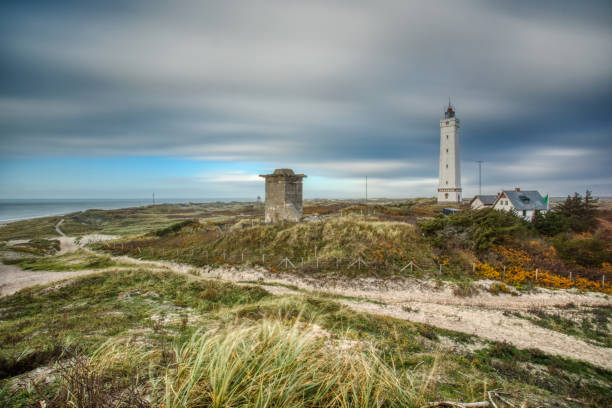 Light house and bunker at a beach in Denmark This picture was taken in November 2018 in Billund Denmark. billund stock pictures, royalty-free photos & images