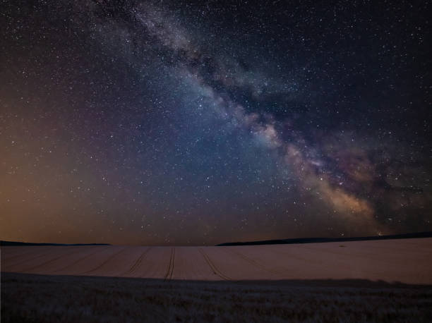 istock Vibrant Milky Way composite image over landscape of wheat field in Summer 1066254804