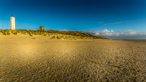 Light house and bunker at a beach in Denmark This picture was taken in November 2018 in Billund Denmark. billund stock pictures, royalty-free photos & images
