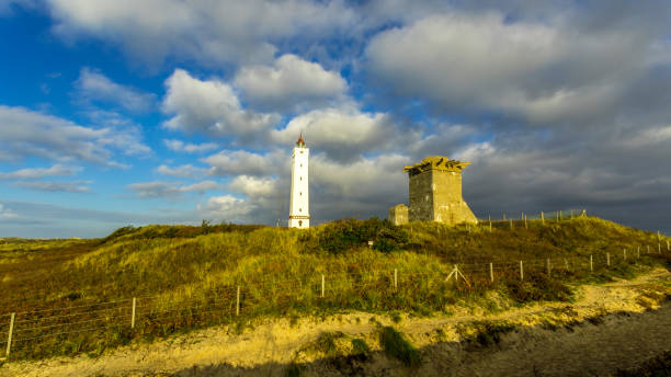 Light house and bunker at a beach in Denmark This picture was taken in November 2018 in Billund Denmark. billund stock pictures, royalty-free photos & images