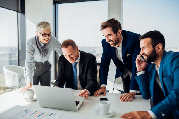 istock Coworkers looking at laptop 1066258092