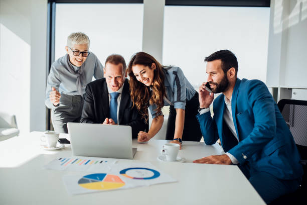 istock People using phone and laptop at office 1066259118