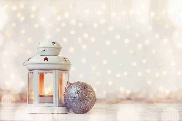 istock White lantern with candle and silver ball - Christmas decoration. 1066259290