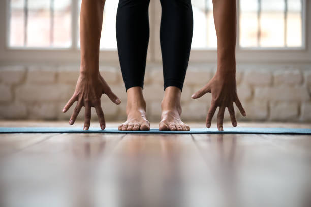istock Sporty yogi woman practicing yoga, doing bend exercise, standing pose 1066259628