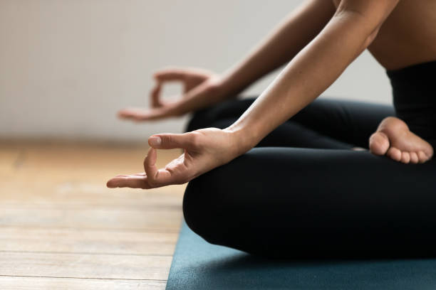 istock Half Lotus pose with mudra gesture close up 1066259644