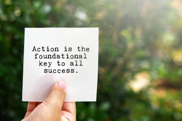 Inspirational quote- Action is the foundational key to all success stock photo