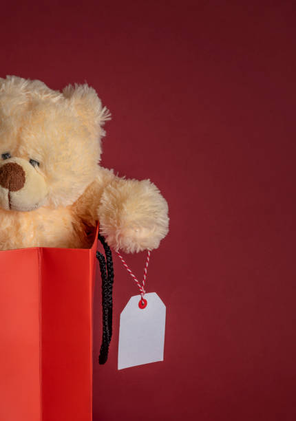 istock Teddy bear toy stuffed in a paper bag. Close-up image with copy space 1066266242