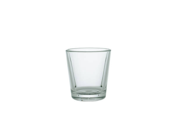 empty shot glass isolated on white background - shot glass imagens e fotografias de stock