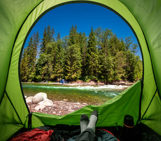 istock View from tent to wild river in Tatras mountains 1066267122