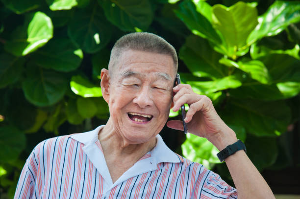istock Elderly man feel so excited and happily chatting on smart phone. 1066272980