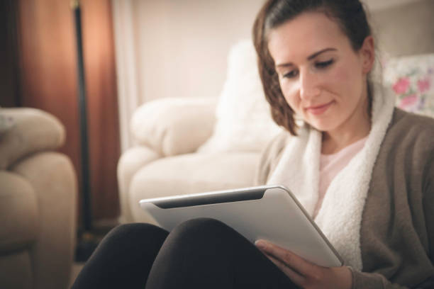 istock Woman works on a tablet - Online shopping 1066276464