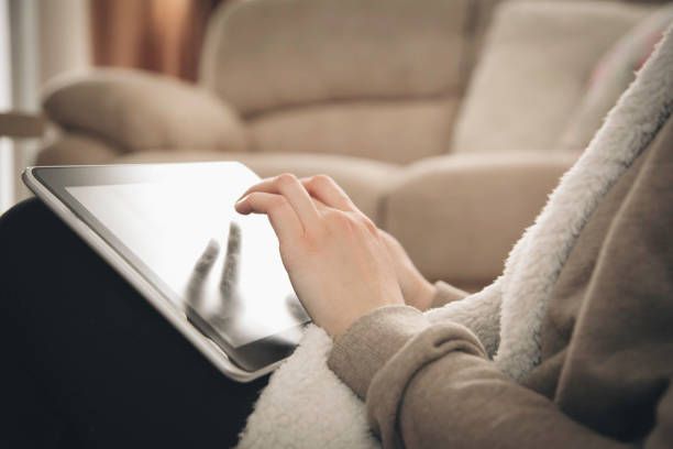 istock Woman works on a tablet - Online shopping 1066276474