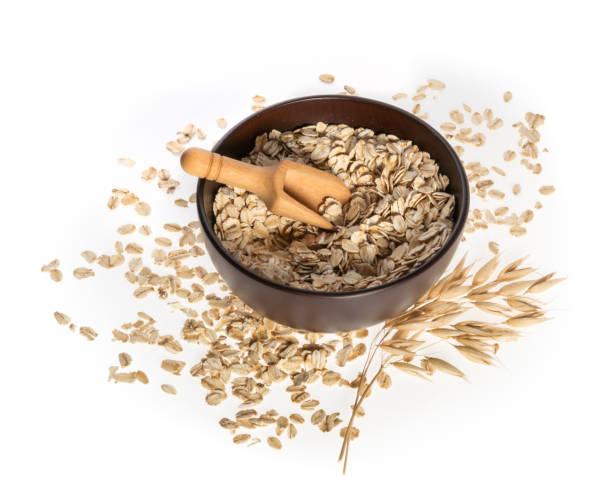 istock Rolled oats, healthy breakfast cereal oat flakes isolated on white top view 1066278490