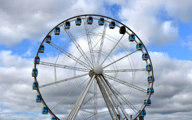 istock Ferris wheel on background of clouds 1066282434