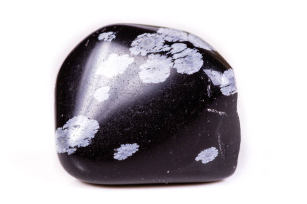 istock Macro mineral stone snow obsidian on white background 1066282714