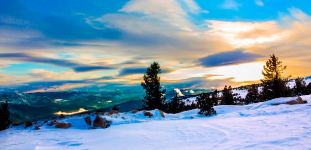 Unreal artistic colorful image of the mountain winter landscape on sunset in cold blue tones
