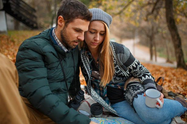 istock Young couple planning their trip with map 1066288770