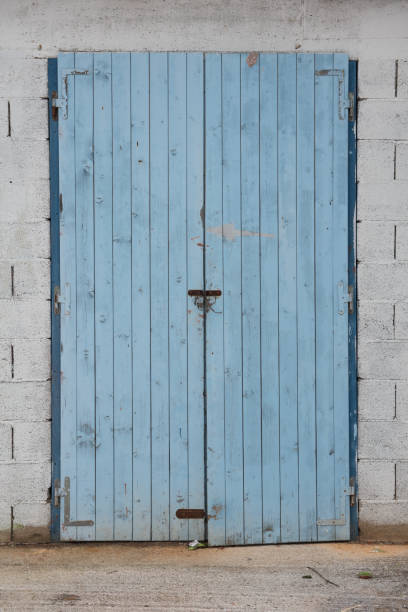 istock Old blue wooden doors. Warehouse entrance 1066291572