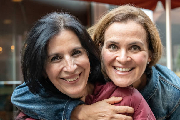 istock smiling mature women posing looking at the camera 1066294174