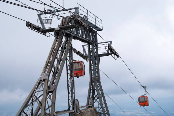 istock Red cable cabin lift in the mountain. 1066295356