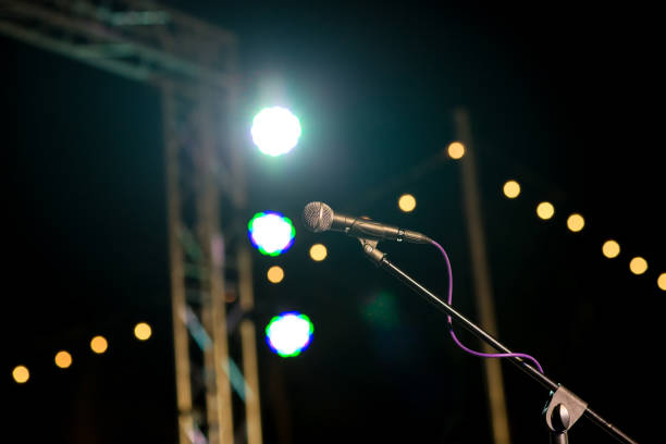 istock microphone in concert hall or conference room soft and blur style for background. 1066301306
