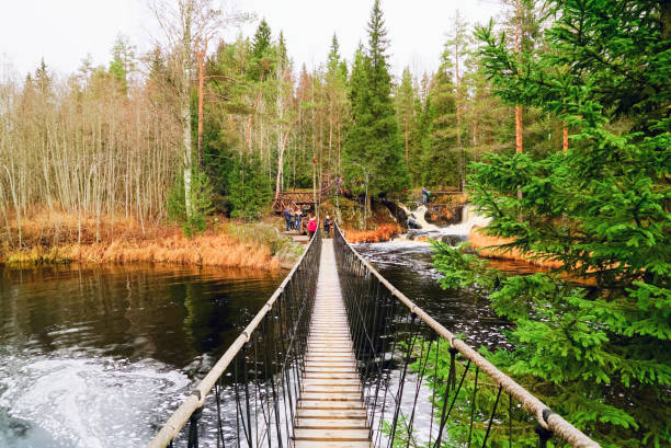istock Suspended pedestrian bridge over a waterfall on the Tohmajoki river. 1066307550