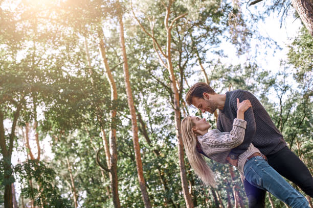 istock Young couple are dancing in autumn forest. 1066313136