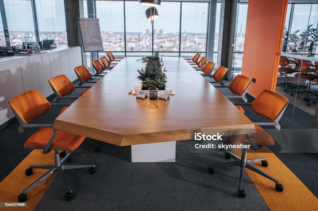 Empty board room! Modern conference hall without people. Orange Color Stock Photo