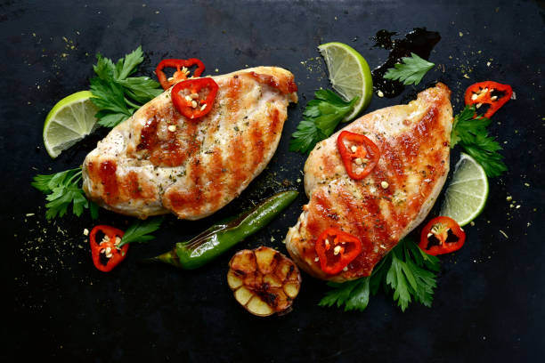 istock Roasted spicy chicken fillet with greens and vegetables 1066320588