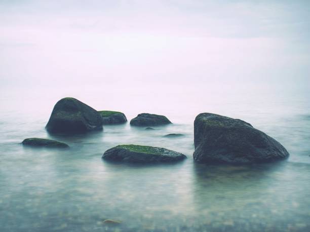 istock Rounded stone and pebble stones on the sea beach 1066323312