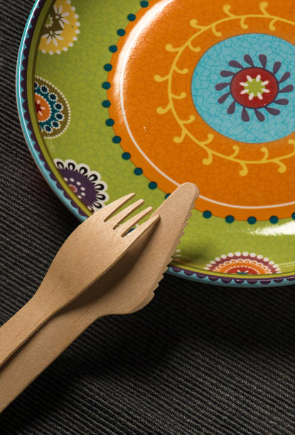istock Plate with an ornament and a wooden knife and fork. 1066329290