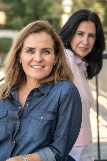 istock smiling mature women posing looking at the camera 1066358350