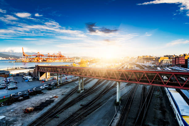 elevated view of cranes and shipping containers at Vancouver Port,with freight railway lines ,Canada.