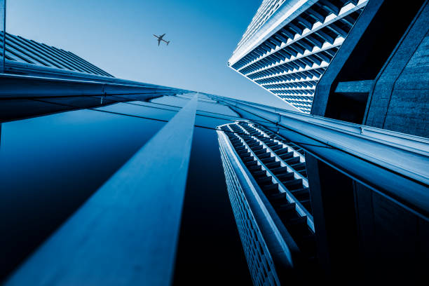 directly below of airplane flying over skyscraper,Vancouver,Canada.