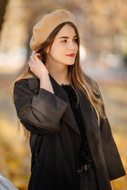 Girl stand on the park background and pose to camera Girl stand on the park background and pose to camera 8571 stock pictures, royalty-free photos & images