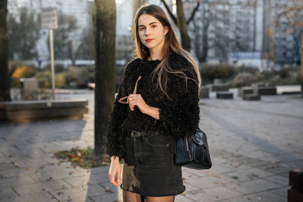 istock Girl stand on the park background and pose to camera 1066365096