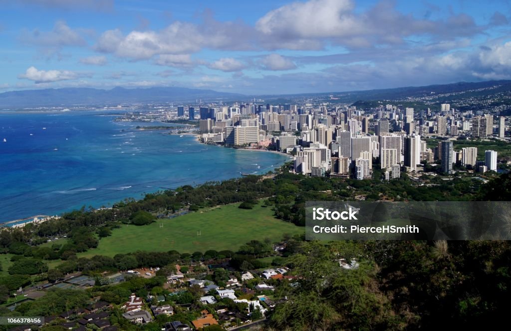 High Altitude View of Waikiki Beach and Coast of Oahu A high altitude view of the southern coast of Oahu, including Waikiki Beach. Mountains can be seen in the distance Agricultural Field Stock Photo