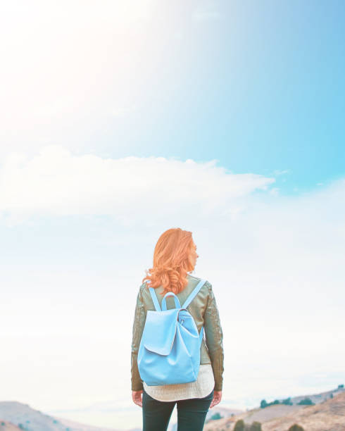 istock Beauty woman outdoors enjoying nature. 1066382814