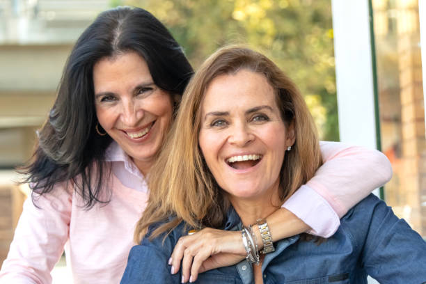 istock smiling mature women posing looking at the camera 1066383182