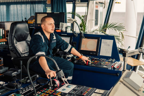 istock Marine navigational officer is maneuvering ship or vessel 1066385608