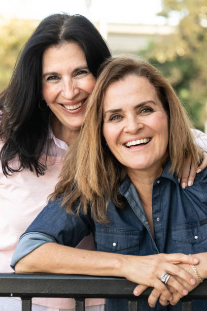 istock smiling mature women posing looking at the camera 1066385642